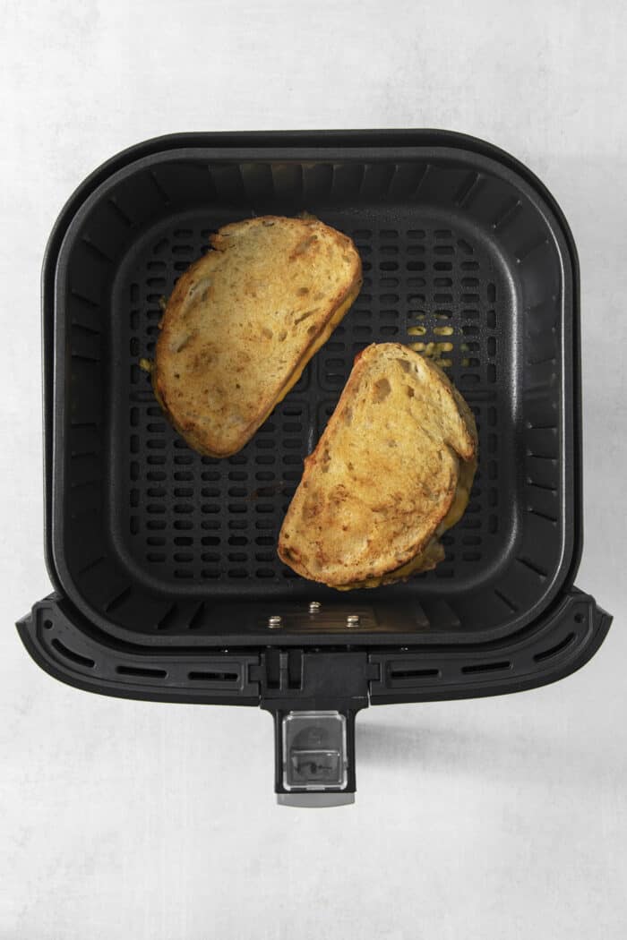 Air Fryer Grilled Cheese | Easy Cheesy Grilled Cheese Recipe! The sandwiches have been flipped over so the other side cooks in in air fryer.
