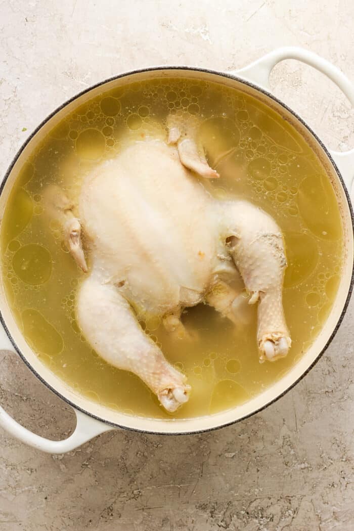 This homemade Chicken Noodle Soup is an easy classic with from-scratch chicken broth loaded with tender chicken, vegetables, and egg noodles. A whole chicken cooks in a pot for homemade chicken stock.