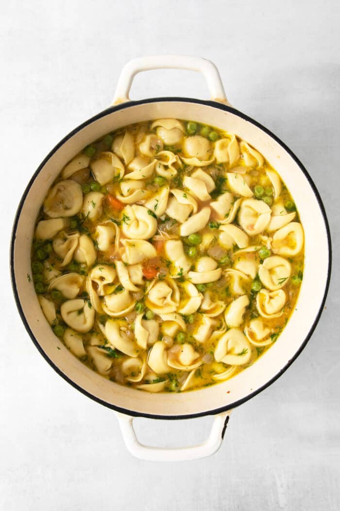 Cheesy tortellini pockets are the stars of this Lemon Chicken Tortellini Soup that also features a lemony broth packed with shredded chicken. Tortellini is added to the broth for lemon chicken tortellini soup.