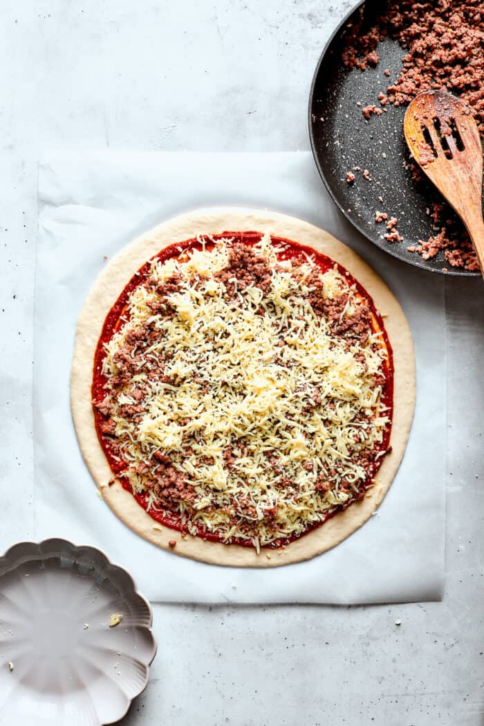 The pizza is topped with mozzarella cheese.