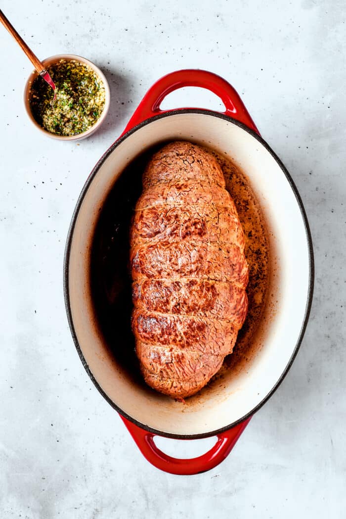 This ultra-juicy Sirloin Tip Roast recipe makes perfectly tender meat every time with plenty of garlic and fresh herbs for added flavor. The cooked roast before being seasoned.