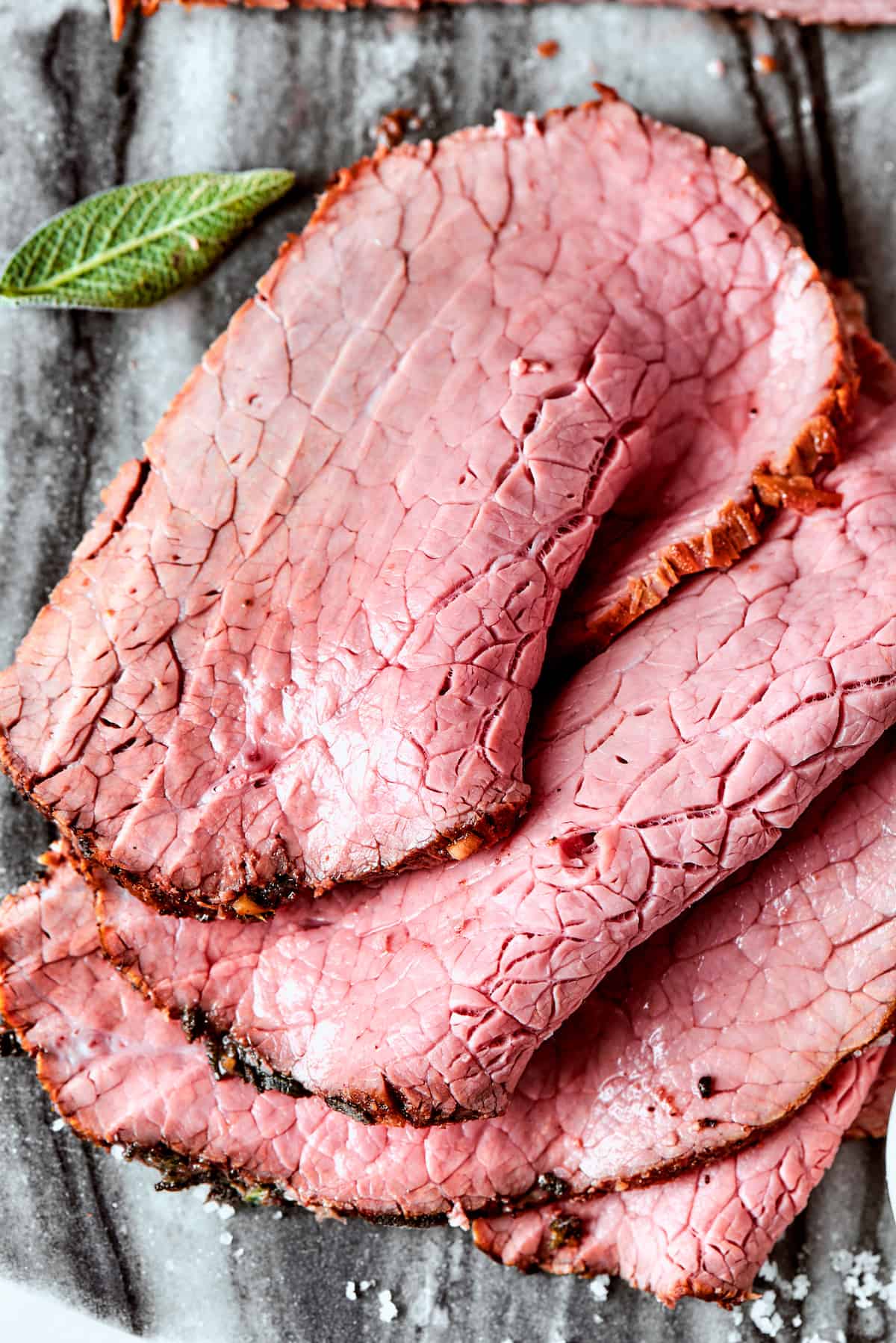 A close up of slices of top round roast.