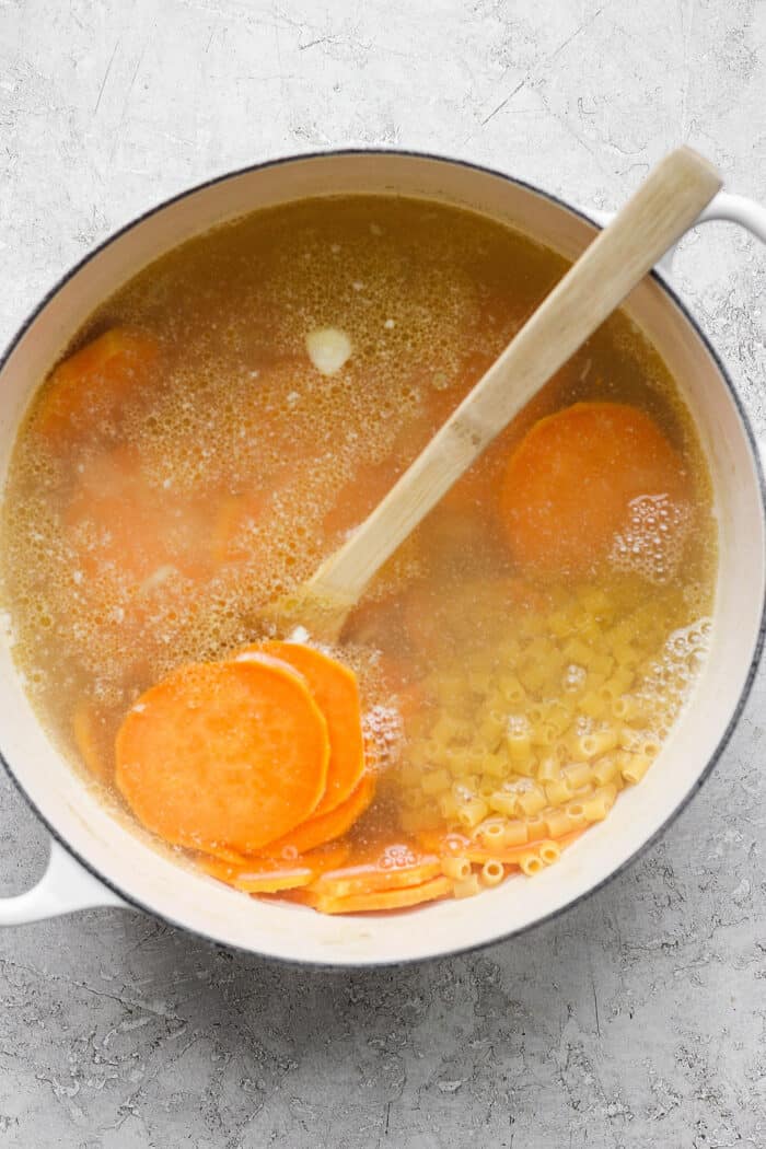 This zesty Chicken Ginger Soup recipe is brimming with fresh ginger, garlic, and lemon plus sweet potatoes, shredded chicken, and pasta. Sweet potatoes and pasta are added into the broth.