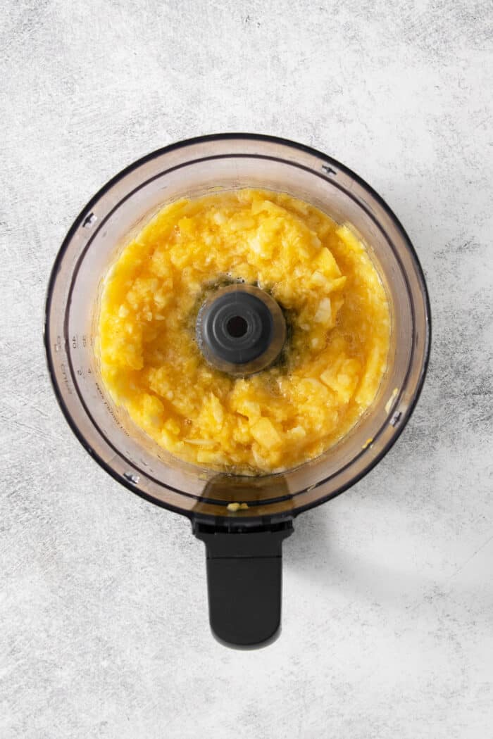 This easy Pineapple Casserole is a sweet and savory southern-inspired dish combining pineapple with cheese that pairs perfectly with BBQ. Pineapple chunks are added to a food processor.