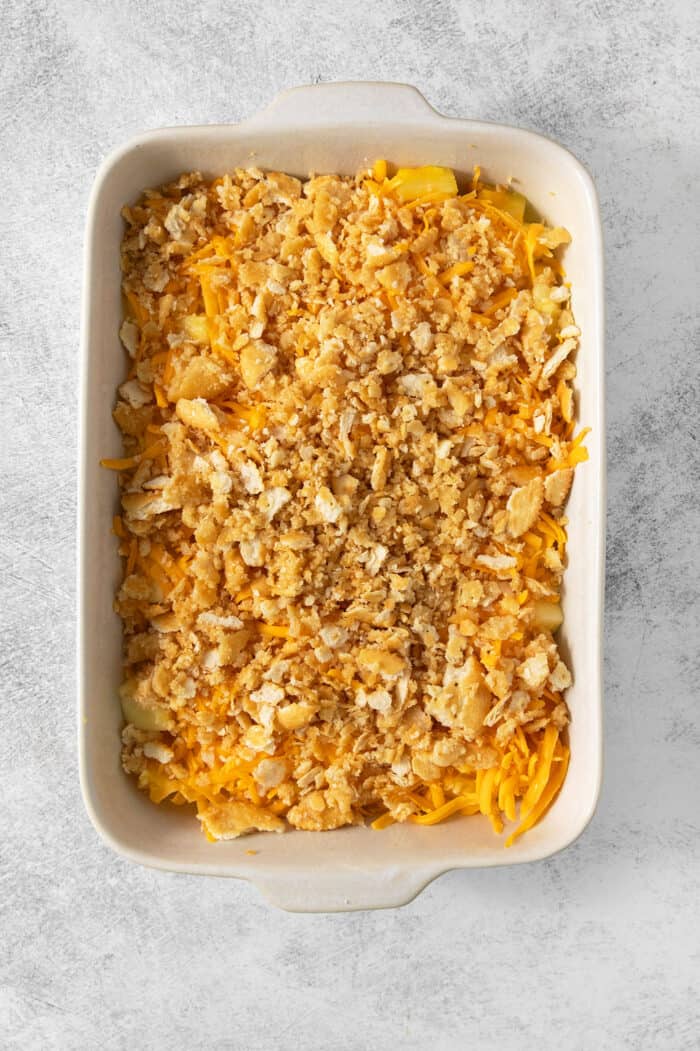 This easy Pineapple Casserole is a sweet and savory southern-inspired dish combining pineapple with cheese that pairs perfectly with BBQ. The crushed crackers are placed on top of the pineapple casserole.
