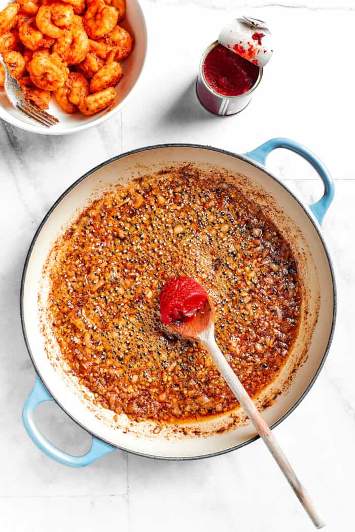 This beautiful, smoky-spicy Cajun Shrimp Pasta recipe folds juicy shrimp into a creamy, Louisiana-inspired sauce. Tomato paste is stirred into the seasonings.