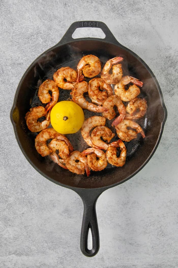 This Blackened Shrimp recipe makes a versatile protein that's ready in less than 10 minutes featuring juicy-crisp, well seasoned shrimp. The shrimp are cooked in a skillet with a lemon.