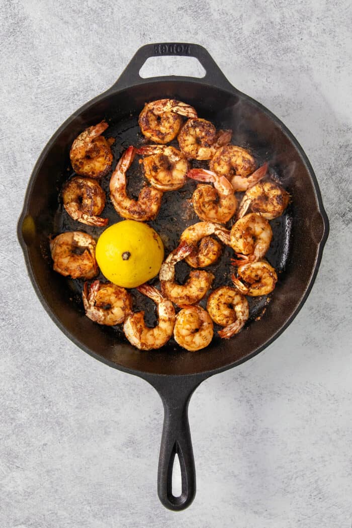 This Blackened Shrimp recipe makes a versatile protein that's ready in less than 10 minutes featuring juicy-crisp, well seasoned shrimp. The shrimp are fully cooked in the skillet with a lemon.