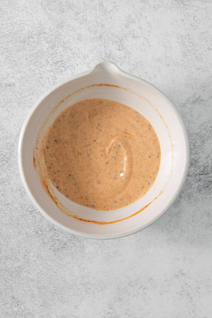 This easy and creamy Shrimp Dipping Sauce the perfect accompaniment for your favorite shrimp recipes, and feature lemon and a kick of heat. The ingredients are whisked together to form a smooth sauce.
