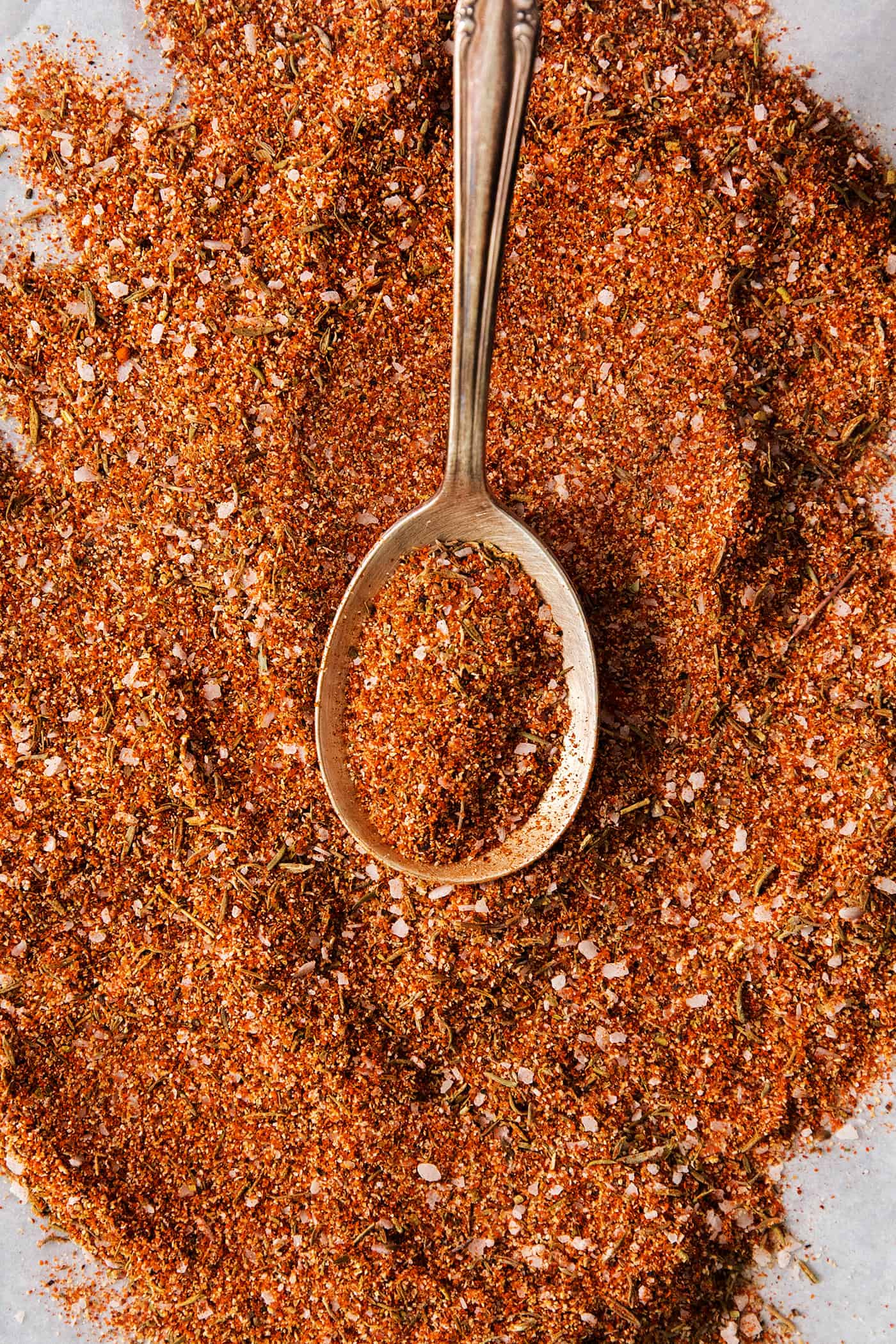 This homemade Blackened Seasoning recipe is rich, earthy, and slightly smoky with the perfect amount of heat! dried spices and herbs mixed, with a spoon