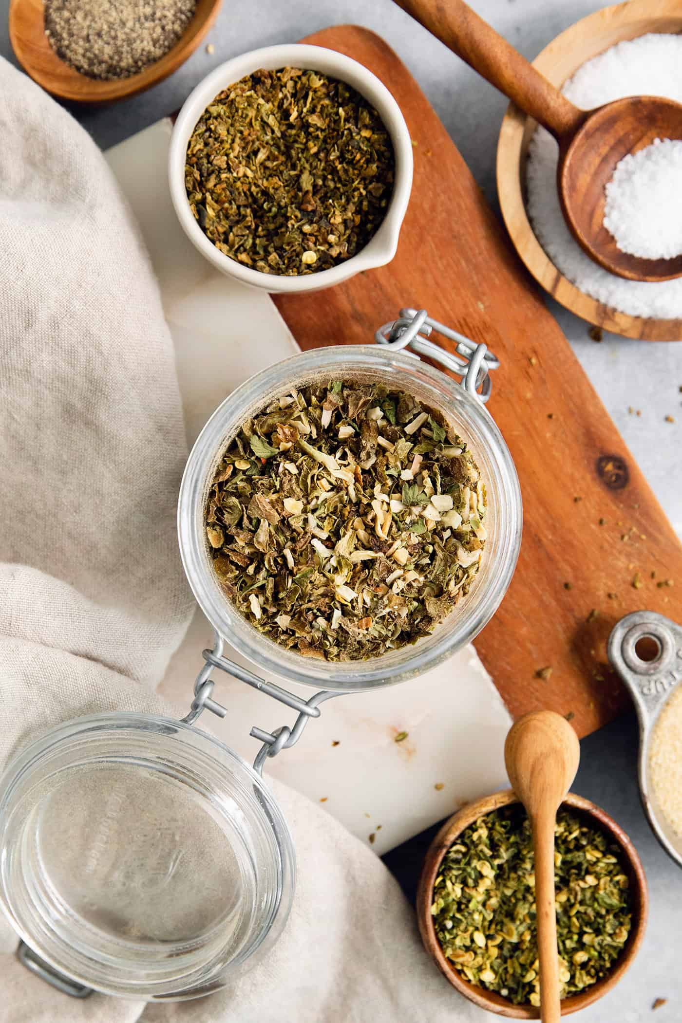 Homemade Green Taco Seasoning is so easy to DIY! It's flavorful, not too spicy, and is perfect in tacos, nachos, quesadillas and more. Jars and bowls of homemade green taco seasoning.
