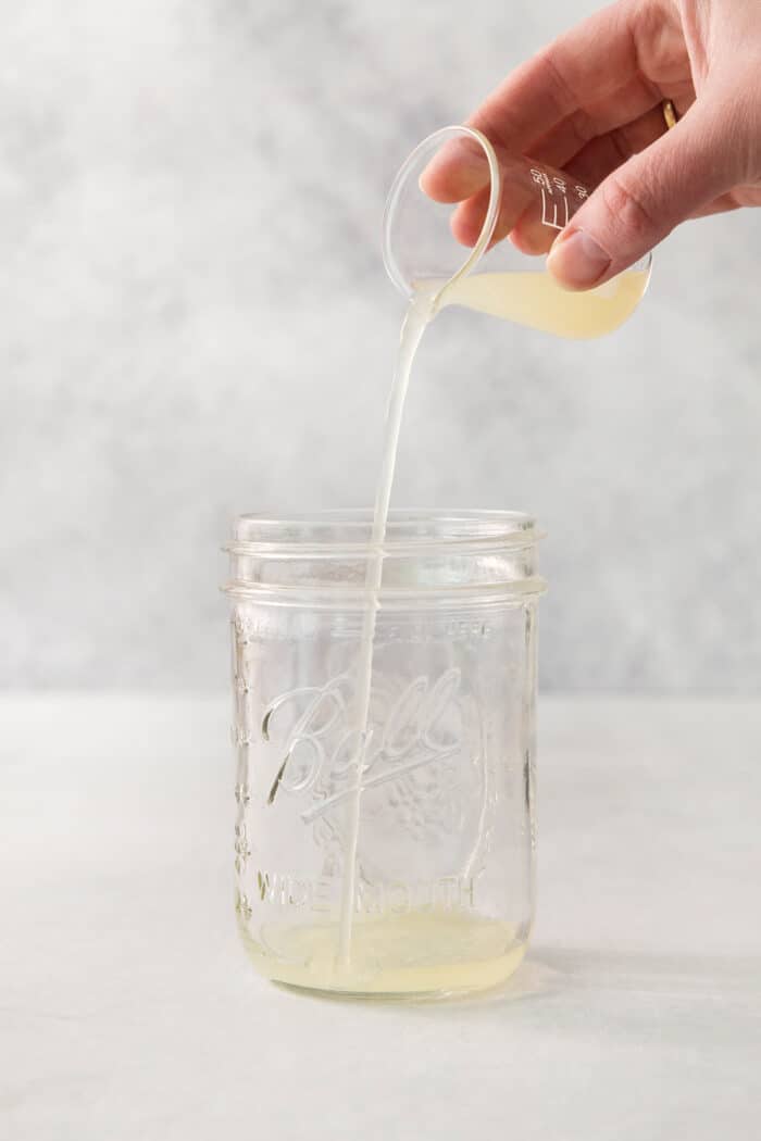 This Classic Margarita recipe makes the perfect tequila cocktail! Learn how to make a margarita that's always crisp, cold, and refreshing. Lime juice is added to a jar to make a classic margarita.