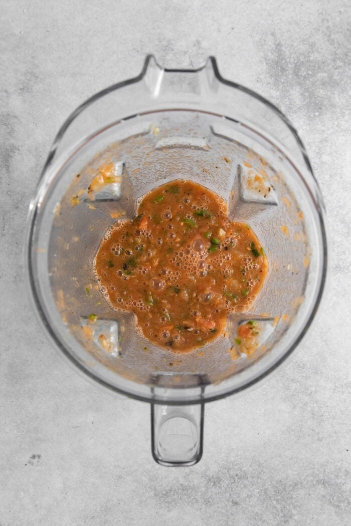 This Warm Salsa recipe is perfectly spiced and juicy, with a pop of lime juice for sweetness. Enjoy it with tacos, quesadillas, & chips. The salsa is blended in the blender.