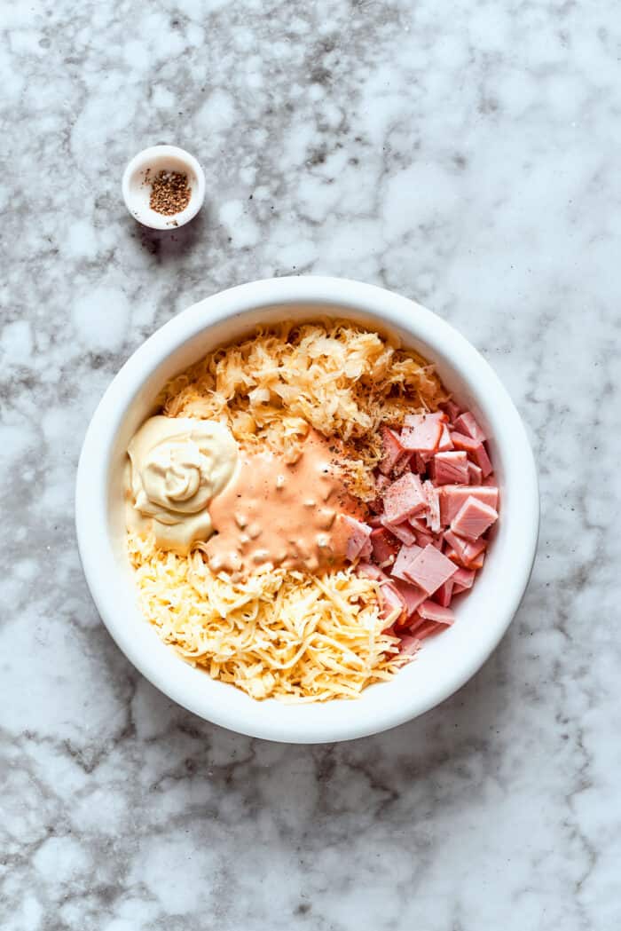 Reuben dip ingredients in bowl