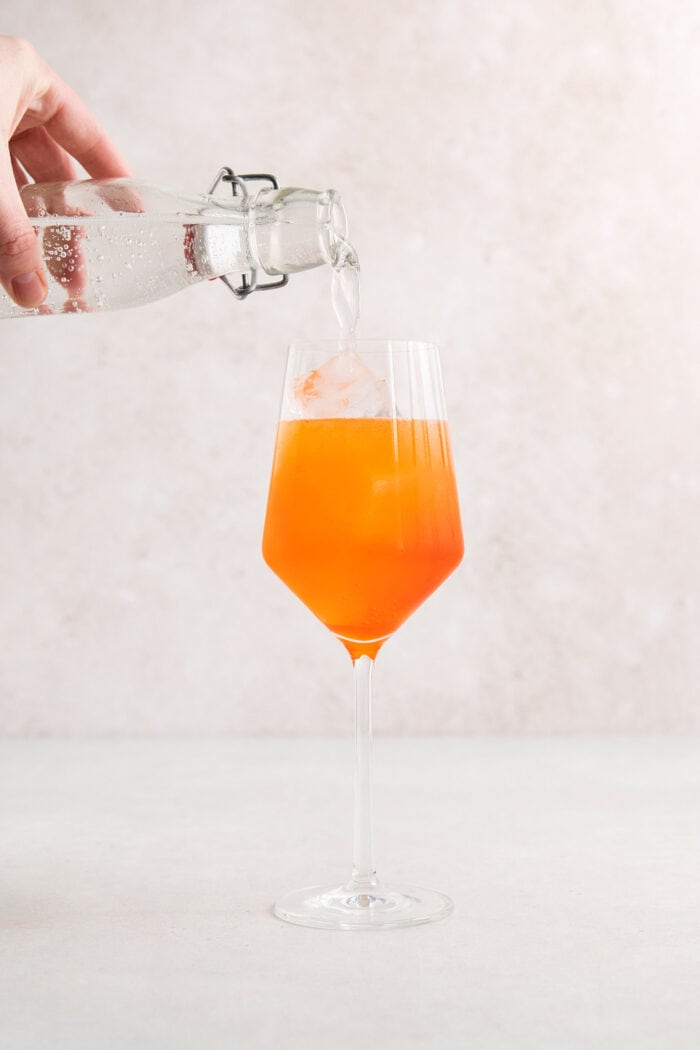 This classic Aperol spritz recipe is my take on an Italian aperitivo and makes a refreshing cocktail out of just four ingredients. The Aperol spritz is topped with club soda.
