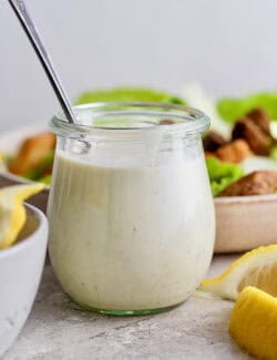 a small jar of Caesar salad dressing