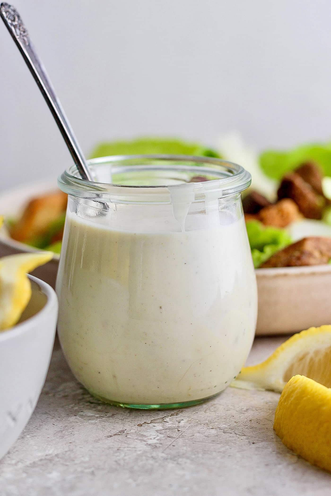 a small jar of Caesar salad dressing