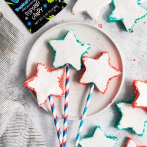overhead photo of star-shaped marshmallows with Pop Rocks, on sticks