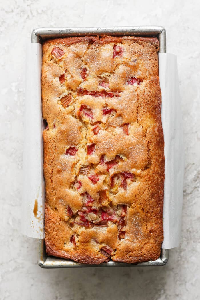This Rhubarb Bread is gorgeously moist and tender, warmly spiced with cinnamon and spiked with orange zest. The rhubarb bread cools in the pan.