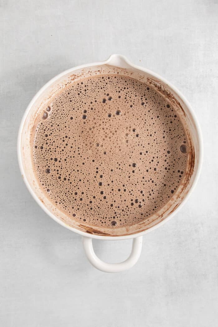 Rocky Road Ice Cream stars a creamy chocolate custard base that's loaded with almonds, marshmallows, and even more chocolate! The milk is added to the base.