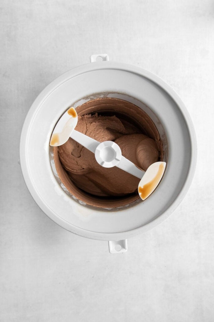 Rocky Road Ice Cream stars a creamy chocolate custard base that's loaded with almonds, marshmallows, and even more chocolate! The chocolate ice cream base churns in the ice cream maker.