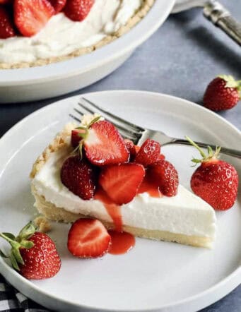 a piece of strawberry cream cheese pie on a white plate