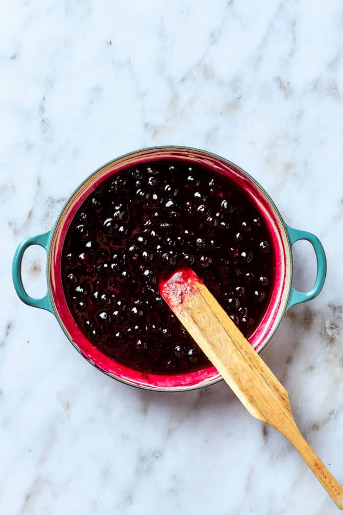 The bluberry mixture begins to thicken.