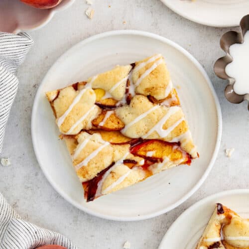 A peach bar is served on a white plate.