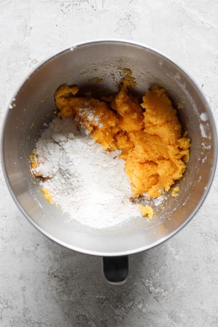 combining flour into creamed butter and sugar mixture, in a metal mixing bowl