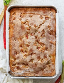 overhead view of baked rhubarb coffee cake in a 9x13 metal pan