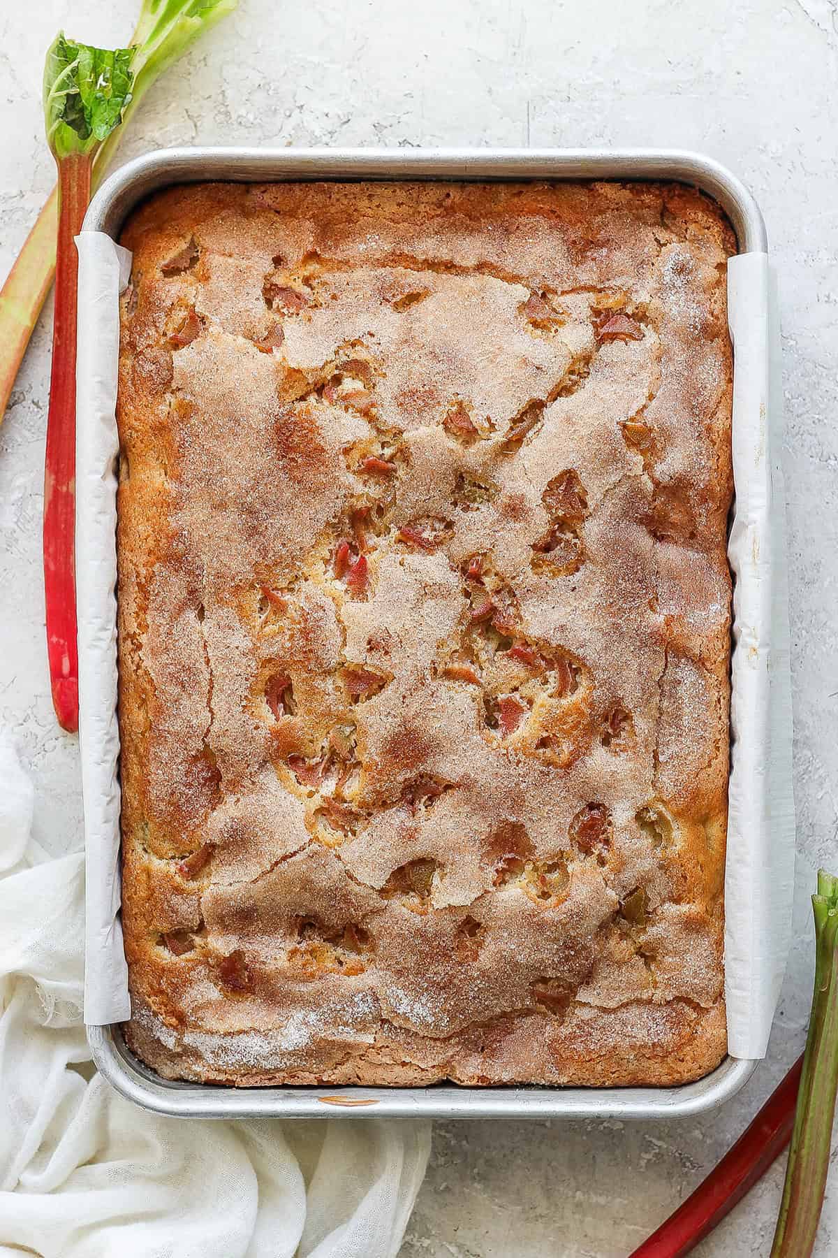 overhead view of baked rhubarb coffee cake in a 9x13 metal pan