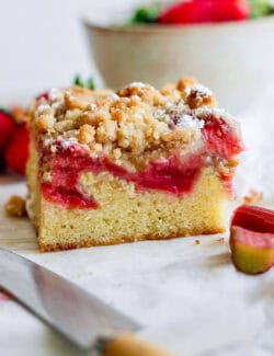 side view of a strawberry rhubarb bar with crumb topping