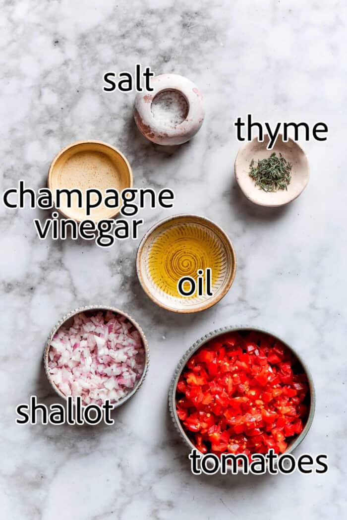 diced tomatoes and shallots, thyme leaves, oil, champagne vinegar, and salt