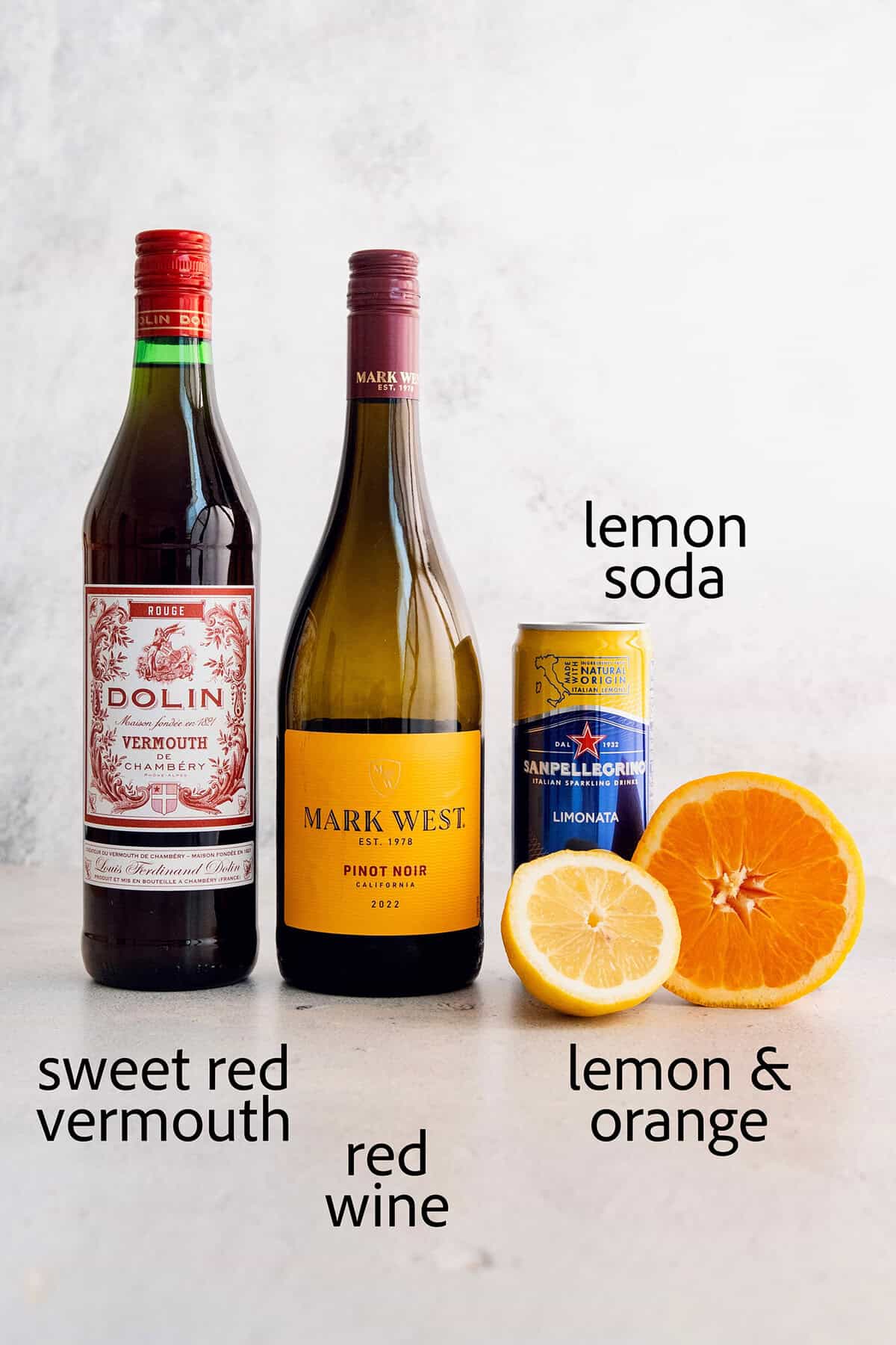 Tinto de Verano, a Spanish summertime cocktail, features fruity red wine, lemon soda, and red vermouth served over ice. Ingredients for tinto de verano: sweet vermouth, red wine, lemon soda, lemon and oranges.