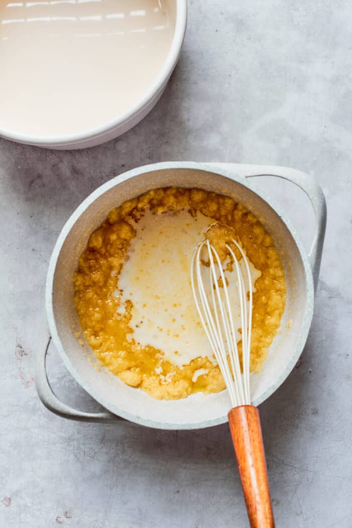 Rømmegrøt is a warmed Norwegian porridge similar to rich pudding, served with a drizzle of melted butter and a good sprinkling of cinnamon! Milk is whisked into the flour and butter mixture.