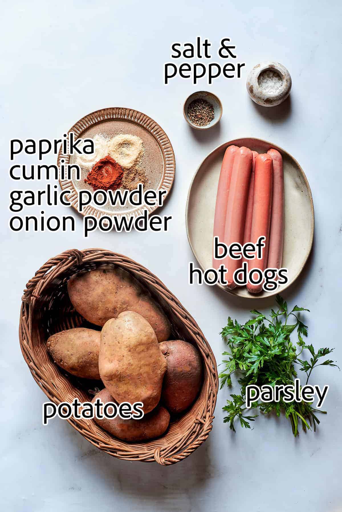 This Salchipapa recipe features crispy homemade french fries scattered with slices of beef hot dogs for a quick meal. ingredients to make salchipapas