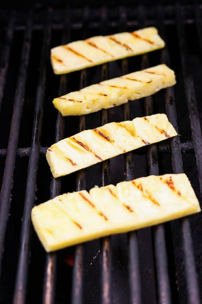 This easy Grilled Chicken Sandwich recipe stars tender, juicy chicken, sweet grilled pineapple, and a creamy homemade basil sauce. Char marks form as pineapple grills.