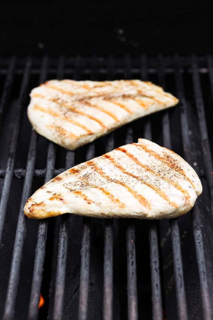 This easy Grilled Chicken Sandwich recipe stars tender, juicy chicken, sweet grilled pineapple, and a creamy homemade basil sauce. Chicken breasts cook on the grill.
