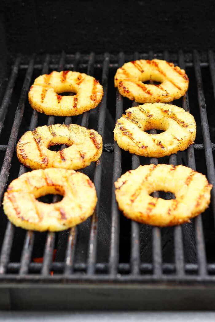 Lightly caramelized and so juicy Grilled Pineapple is a blend of sweet and spicy, perfect on top of burgers or as a dessert. Char marks form on rings of pineapple as they grill.