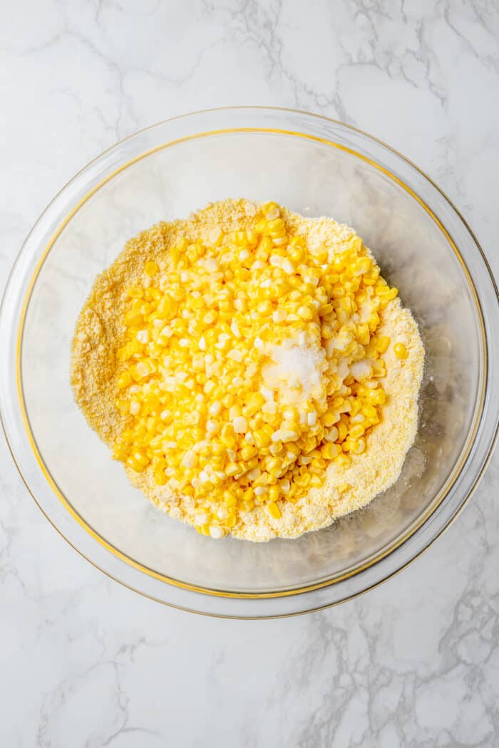 mixing the ingredients together, in a clear bowl