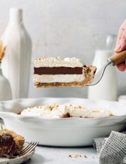 Grabbing a slice of layered possum pie with a spatula.