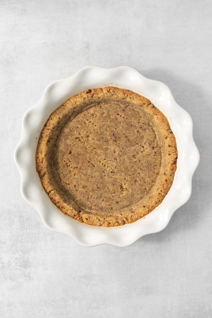 This chilled possum pie recipe with three layers of chocolate, cream cheese, and whipped cream goodness will be your new favorite dessert. Baked crust in the pie plate.