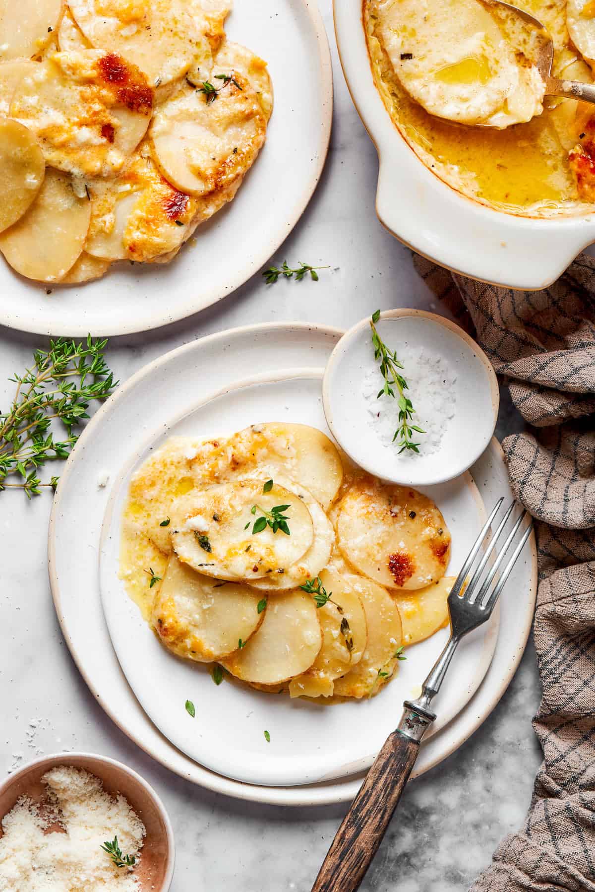 Scalloped potatoes on a serving plate. 