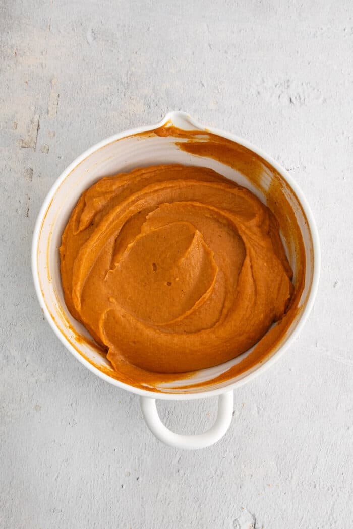 pumpkin pie mixture in a white bowl