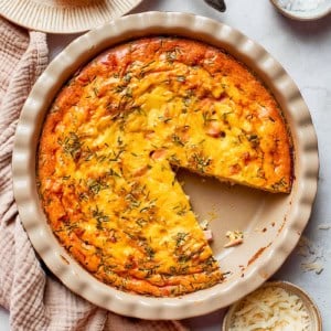 overhead photo of a pie plate of baked crustless quiche