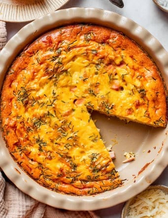 overhead photo of a pie plate of baked crustless quiche
