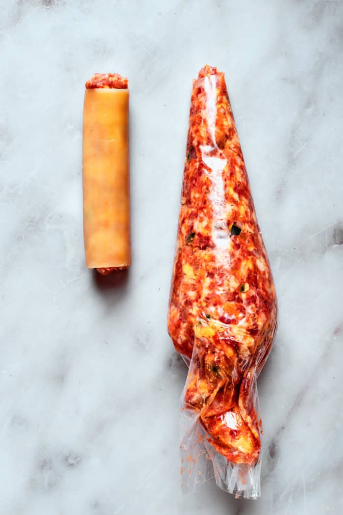 This baked shotgun shells recipe is a simpler version you can make in the oven — no smoker required! Smoky, savory, spicy and irresistible! Piping bag set next to filled shotgun shell