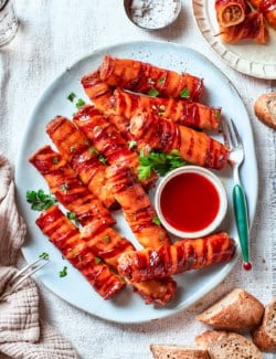 Overhead view of shotgun shells with bowl of barbecue sauce for dipping