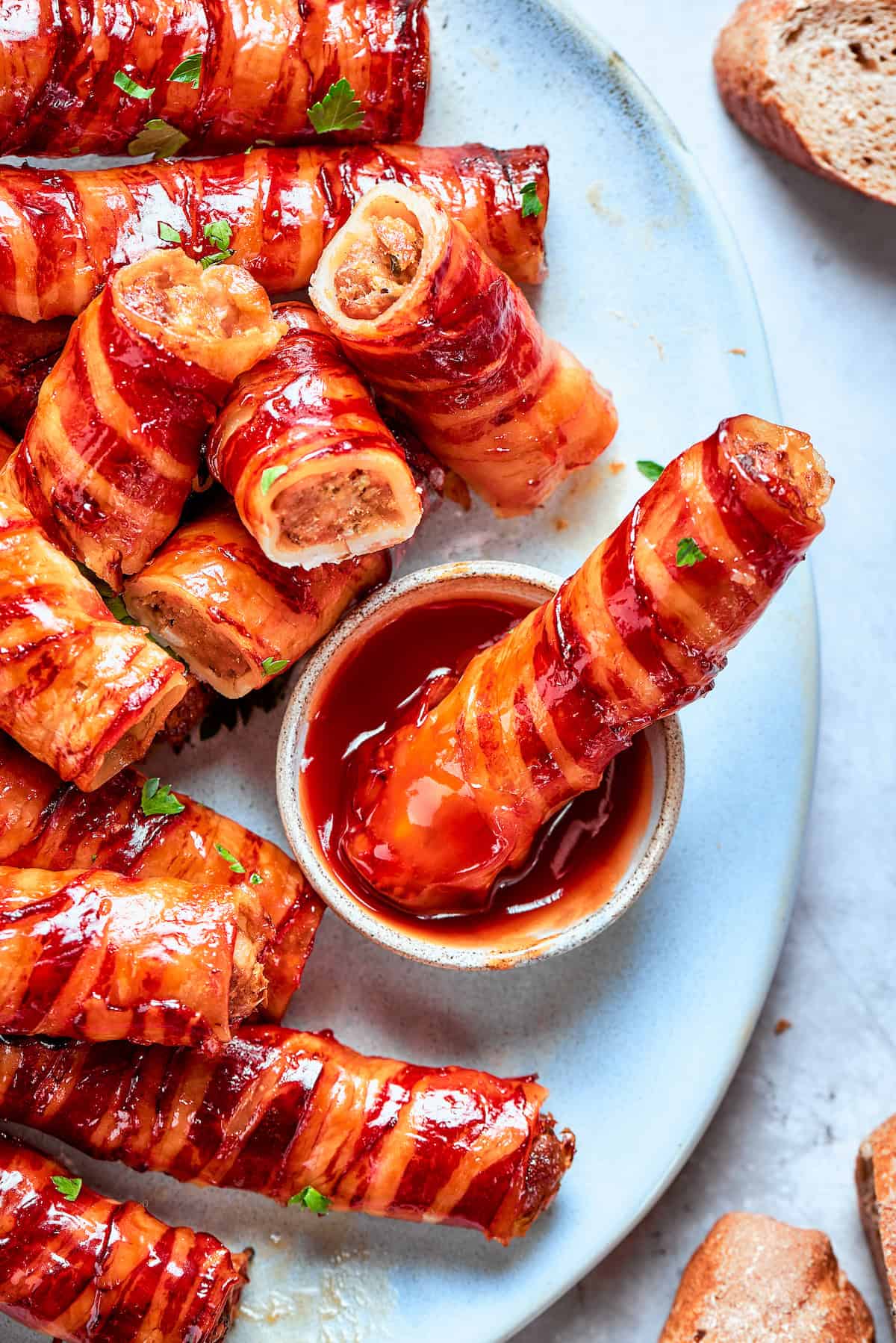 This baked shotgun shells recipe is a simpler version you can make in the oven — no smoker required! Smoky, savory, spicy and irresistible! Dipping baked shotgun shell into barbecue sauce