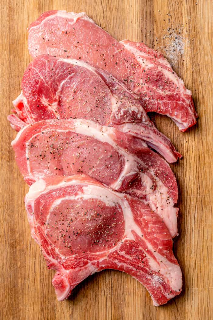 pork chops on a wood cutting board